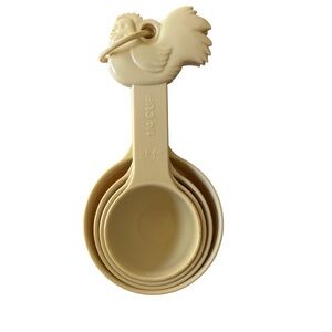 Cream colored Paula Deen Nesting Rooster Measuring Cups set.